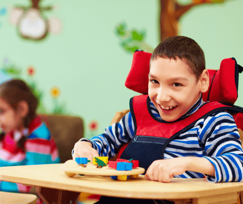 Boy with disability playing.png